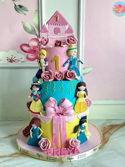 A sweet story told in cake form. This four-tiered princess cake for Freya is a vibrant masterpiece, with each layer telling a different part of a fairytale.