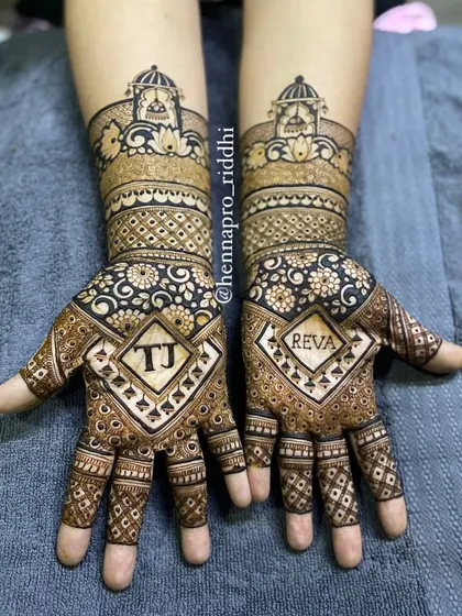 A beautiful way to symbolize partnership is by including initials. This design features the couple's initials, 'TJ' and 'REVA', inside elegant diamond-shaped frames on each hand.
