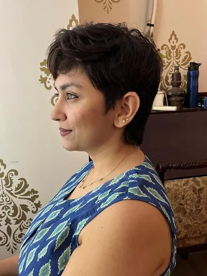 A side view of the textured pixie cut.