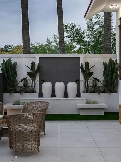This render showcases the sitting area of the designed front verandah. It features comfortable wicker chairs, a water feature with decorative urns, and vertical planters, providing a green and relaxing escape from busy city life.