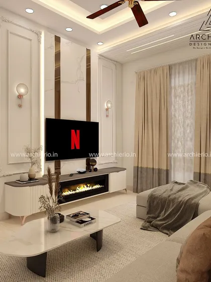 A cozy living room with an L-shaped sofa, a built-in fireplace in the TV unit, and classic wall mouldings for a touch of elegance.