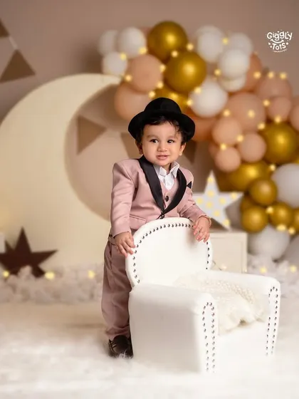Your little one is the star of the show. This dapper first birthday setup with a moon and stars theme shows how we can celebrate your baby's big milestones in style.