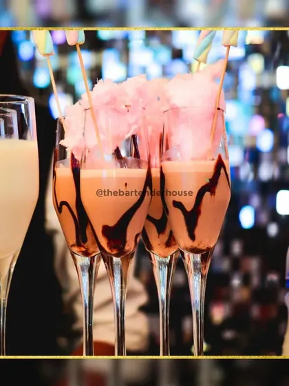 A sweet sensation for the dessert lovers. This chocolate milkshake cocktail is drizzled with more chocolate and topped with a fluffy cloud of pink cotton candy.