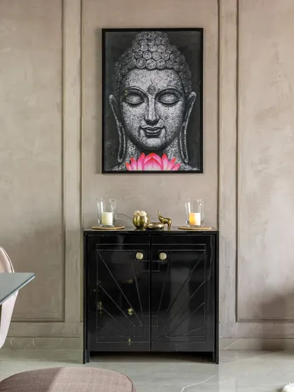 A serene corner in 'Maison-De-Confort', featuring a custom black console and a calming Buddha artwork. This space is designed for quiet reflection.