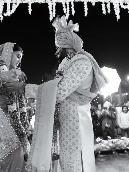 A beautiful black and white photo of the bride and groom during their Varmala ceremony. This shot captures the intensity and emotion of the ritual.