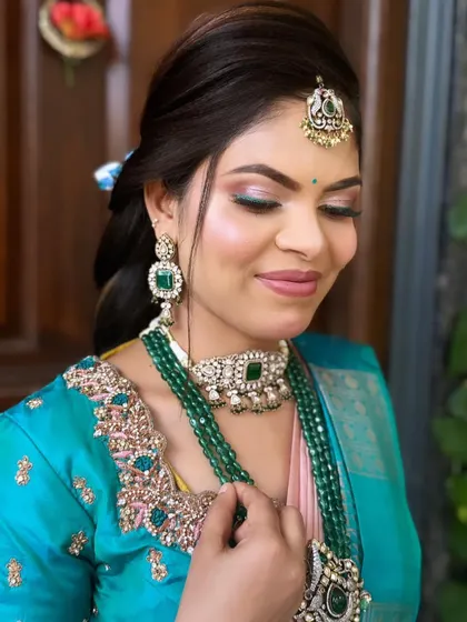 Another look at this beautiful color combination. The makeup is designed to be vibrant and fun, perfect for a lively reception party.