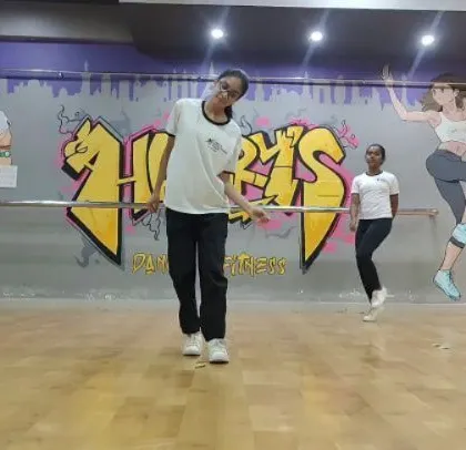 Our senior students practicing their moves for the "Brown Munde" dance video. This shot shows their focus on technique and using the ballet barre for support.