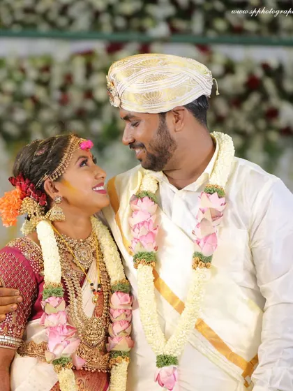 A classic, happy portrait of the couple in their wedding attire. Their smiles and the way they look at each other tell a beautiful story of love and companionship.