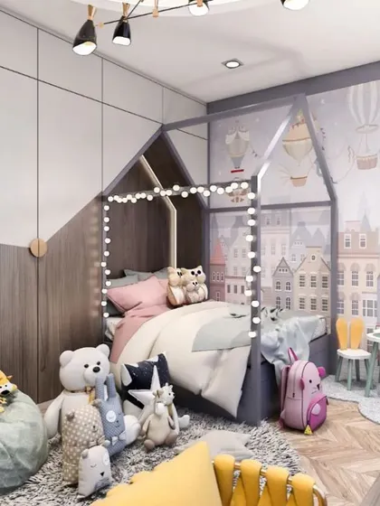 A whimsical kids' room with a house-frame bed and a charming city-themed wallpaper. The space includes a cozy beanbag, a small play table, and plenty of soft toys for a playful atmosphere.