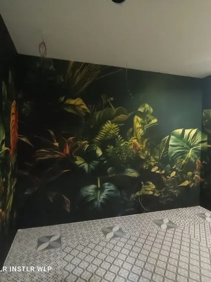 A dark, moody tropical jungle mural. The deep colors create a dramatic and immersive experience, perfect for a powder room or accent wall.