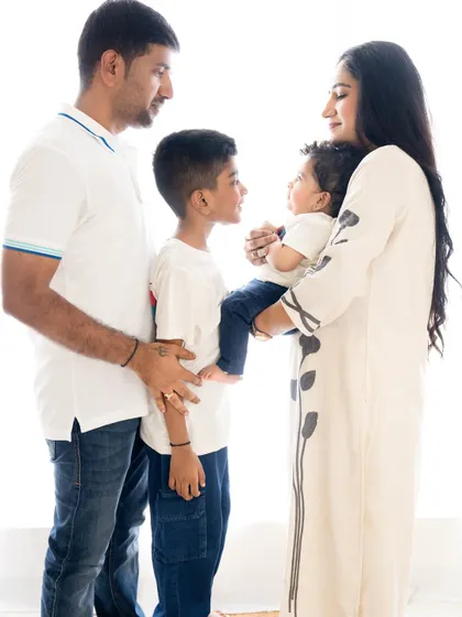 A beautiful silhouette-style shot of the family interacting, highlighting their connection and bond.