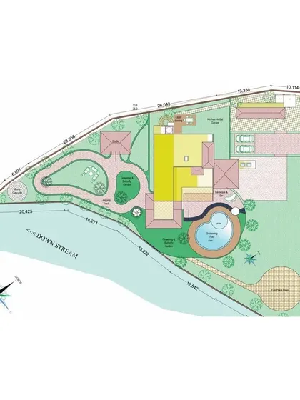 A wider view of the Jim Corbett farmhouse site plan, showing its relationship to the adjacent stream. The design ensures a strong connection to the natural water body.