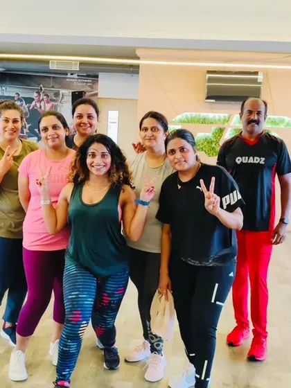 The heart and soul of my classes. Each photo captures a unique moment with my incredible community after a sweaty, joyful session. This is our shared victory lap.