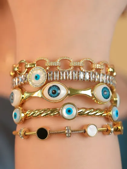 All eyes on this stack. A close-up of my most popular evil eye bangles, featuring different sizes and styles for a truly unique look.