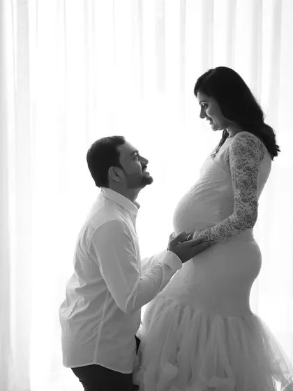 A romantic black and white silhouette. This high-contrast style creates a powerful and emotional image, focusing on the connection between the couple.