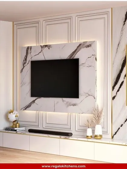 This design combines classic wall molding with a striking marble TV surround. The result is a timeless and elegant entertainment center that feels both modern and traditional.