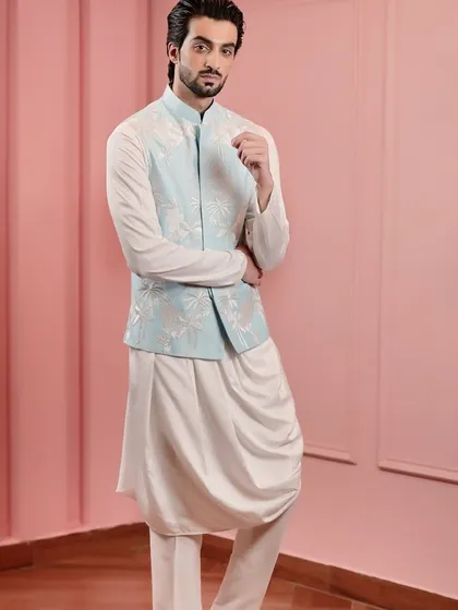 The clean lines and exquisite embroidery of this Nehru jacket make it a standout piece. It's perfect for a wedding guest or for any festive celebration.
