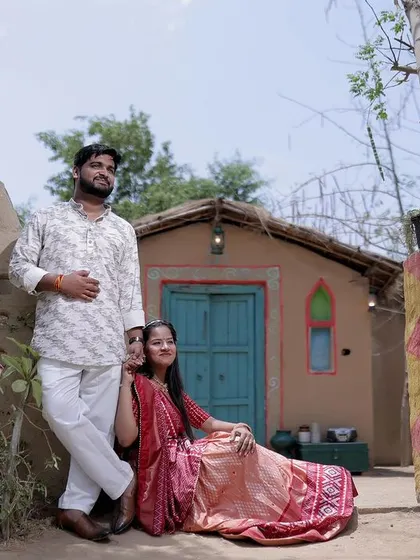 A beautiful family or couple portrait taken at our rustic village set, showcasing the authentic and picturesque quality of this popular backdrop.