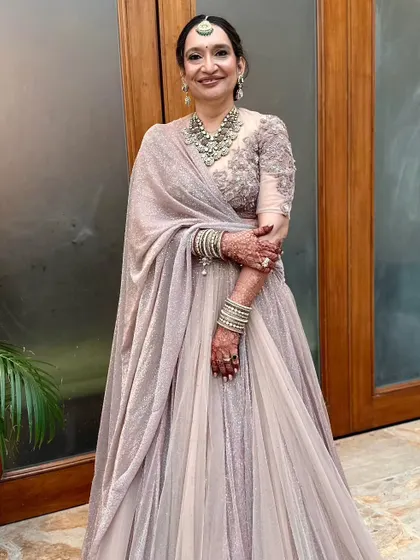 The full look for the mother of the bride. She looks elegant and sophisticated in her Tarun Tahiliani outfit.