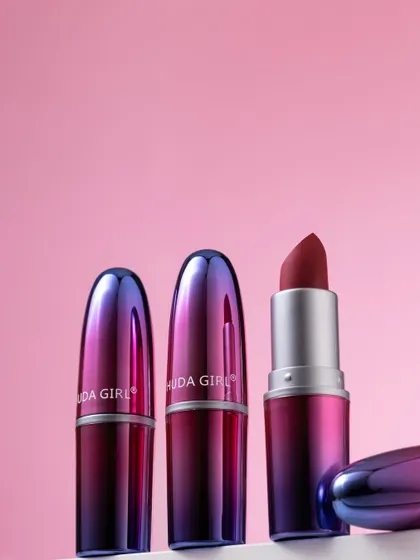 A group shot of Huda Girl lipsticks with their iridescent caps. This composition highlights the product's beautiful design from multiple angles.
