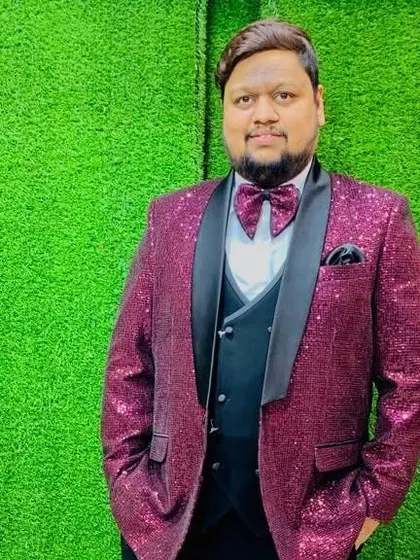 Another photo of the client in the dazzling magenta sequin jacket, ready for a big celebration.