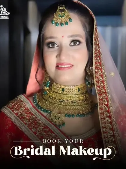 A classic bridal look with a red lehenga and gold jewellery. The makeup is timeless, with defined eyes and a lip color that complements the entire ensemble.