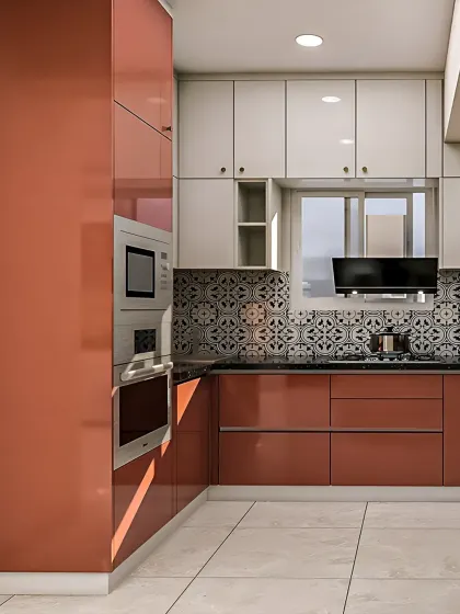 I love adding a pop of color. This kitchen features vibrant terracotta-colored cabinets paired with white overheads and a patterned tile backsplash for a unique and energetic look.
