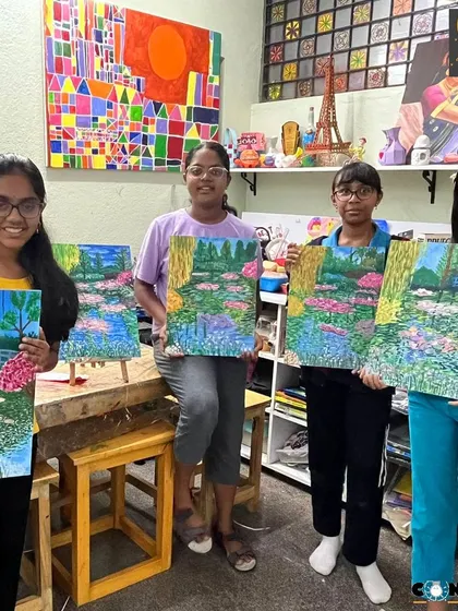 A group of our talented young artists showing their beautiful Monet-inspired lily pond paintings. It's wonderful to see them explore classic art movements.