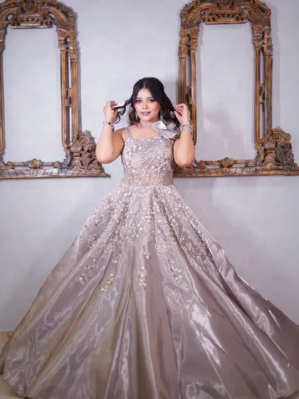 Another pose in the grey satin gown, showing its flattering silhouette.