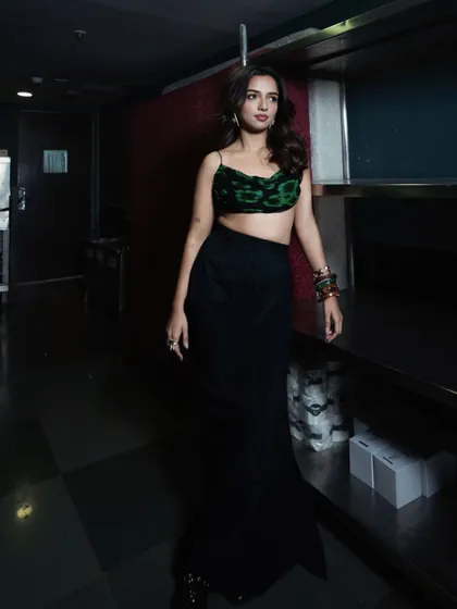 A full-body shot in a different setting, showing how the outfit moves and looks in a more candid, walking pose.