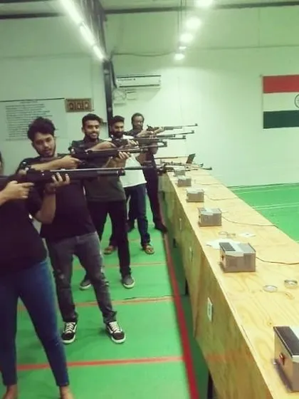 Friends enjoying a competitive session together. You can see the different levels of focus and fun happening all at once on the firing line.