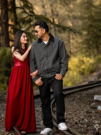 A relaxed and stylish pose on the railway tracks, capturing the cool, confident vibe of the couple.