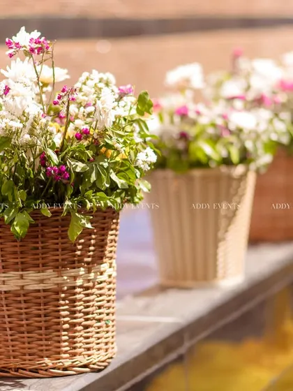 Another view of the charming wicker baskets filled with flowers, a simple yet effective decor element.