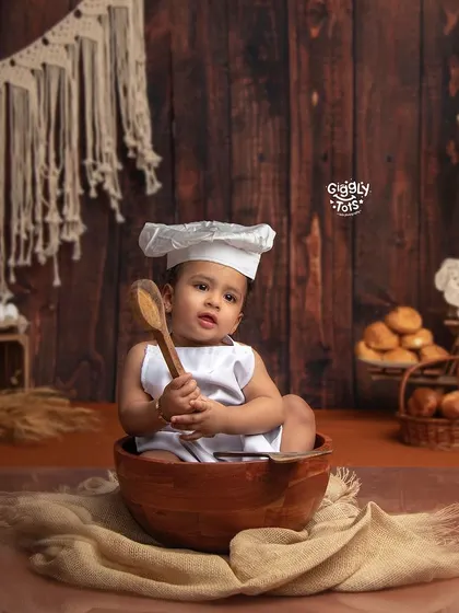 Baking up some cookies! A little chef sits in a mixing bowl, ready to create some delicious treats in our rustic bakery setup.