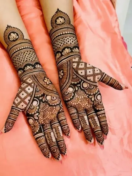 An elegant design featuring prominent lotus mandalas on the back of the hands and wrist, symbolizing beauty and purity.