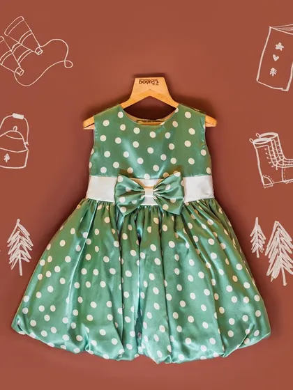 This graphic features a lovely green polka dot dress with a bubble hem, a perfect comfortable frock for the summer season.