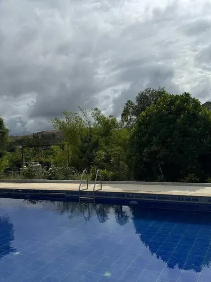 Our swimming pool overlooks the natural landscape, offering a space for gentle exercise or simply relaxing by the water. The clear blue water mirrors the sky, creating a seamless connection with the outdoors.