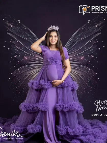 For the mother who dreams of a fairytale, we bring your vision to life. This portrait features one of our elegant, ruffled maternity gowns in a rich purple, complete with a crown and ethereal wings for a truly regal and magical look.