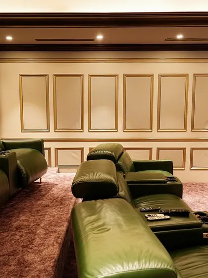 This shot showcases the beautiful details of the room, including the custom wall moldings and the plush, textured carpet.