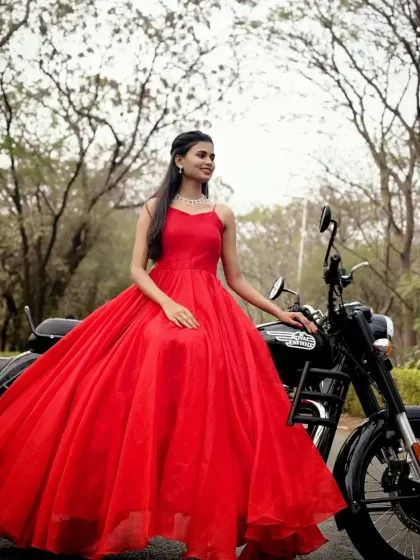 A modern princess moment. This simple yet stunning red ball gown paired with a motorcycle creates a cool and edgy vibe for a unique pre-wedding shoot.