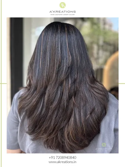 Subtle yet striking auburn chestnut highlights on a rich brunette base, creating a warm and sophisticated look.