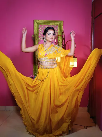 A fun and energetic shot of the yellow Haldi lehenga, perfect for capturing the spirit of the occasion.