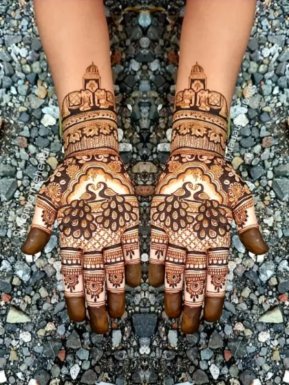 This bridal design features royal elephants under a canopy on the wrist, with majestic peacocks on the palm. It's a perfect example of how I incorporate traditional Rajasthani motifs into my work.