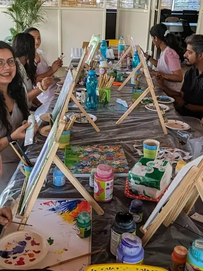 A full view of a canvas painting workshop in session. It's a great social activity and a wonderful way to meet new people.