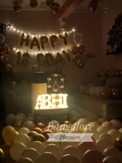 Here is the same 18th birthday setup with the lights on, showing how the marquee letters and fairy lights create a warm glow. I can customize the lighting to create the exact mood you're looking for.