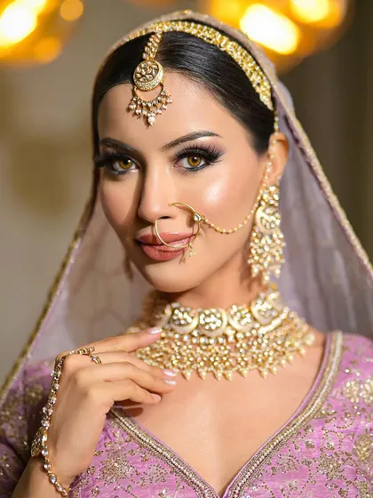 A close-up portrait of the dewy, kohl-eyed look, showing the fine details of the eye makeup and the flawless skin.