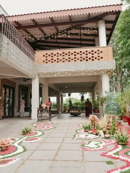 We love the timeless charm of a Chettinad house. For this wedding, we designed the decor to complement the venue's heritage, using traditional floral arrangements and cultural motifs to create an authentic atmosphere.