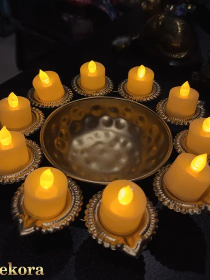 Our exclusive Diwali diya range, featuring electric candles in ornate golden holders. These are perfect for bulk orders as they are easy to set up, safe, and can be reused every year.