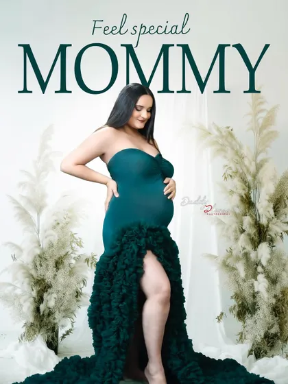 A powerful and confident portrait of a mom-to-be in a dark green ruffled gown. The "Feel special MOMMY" text adds a lovely affirmation to this beautiful image.