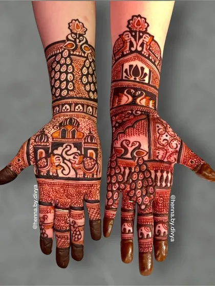 A mirror-image bridal design with a modern twist. The palms feature abstract swan and elephant figures, while the arms have peacock feather patterns and lotus motifs at the top.
